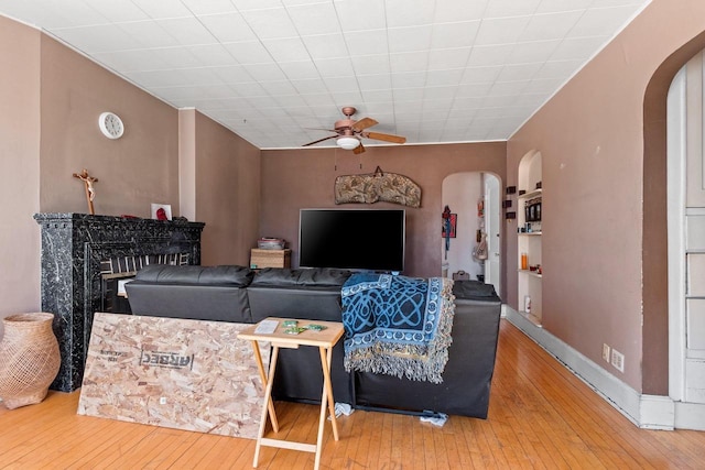 303 N Ashland Ave, Green Bay, WI 54303 - living area featuring hardwood / wood-style floors, a ceiling fan, and arched walkways