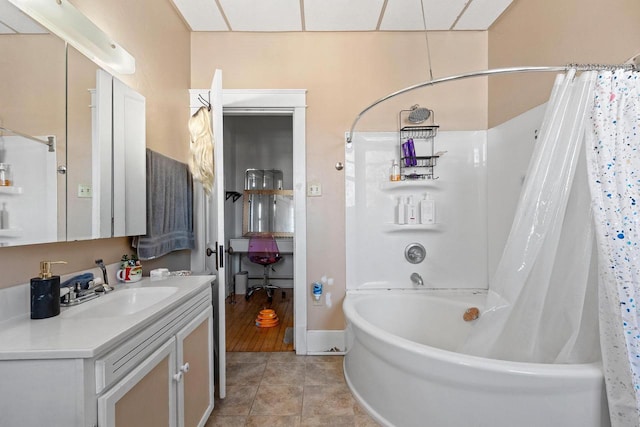 303 N Ashland Ave, Green Bay, WI 54303 - full bath with tile patterned floors, baseboards, vanity, and shower / bathtub combination with curtain