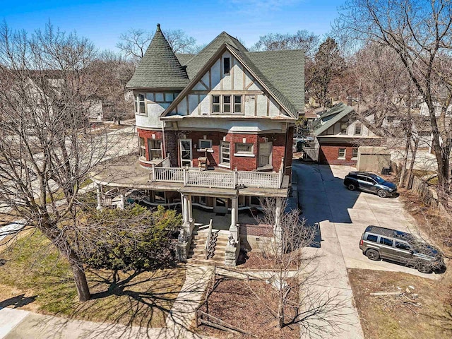 303 N Ashland Ave, Green Bay, WI 54303 - view of front of house with roof with shingles, brick siding, and stucco siding