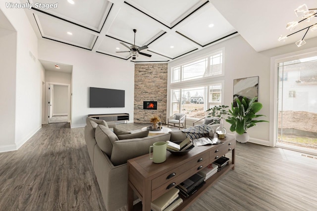 living room with coffered ceiling, baseboards, a ceiling fan, and wood finished floors