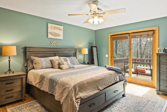 bedroom featuring ceiling fan, access to exterior, and light wood-style floors