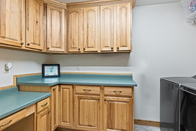 laundry room featuring cabinet space and washer and dryer