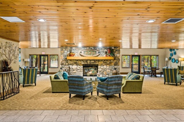 living area with wood ceiling, a fireplace, visible vents, and recessed lighting