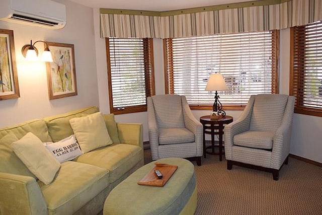 living room with a wealth of natural light, a wall unit AC, and light carpet