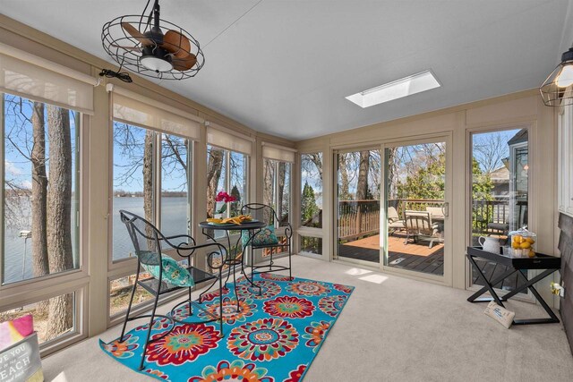 1096 Lakeshore Dr, Menasha, WI 54952 - sunroom / solarium featuring carpet, a water view, and a skylight