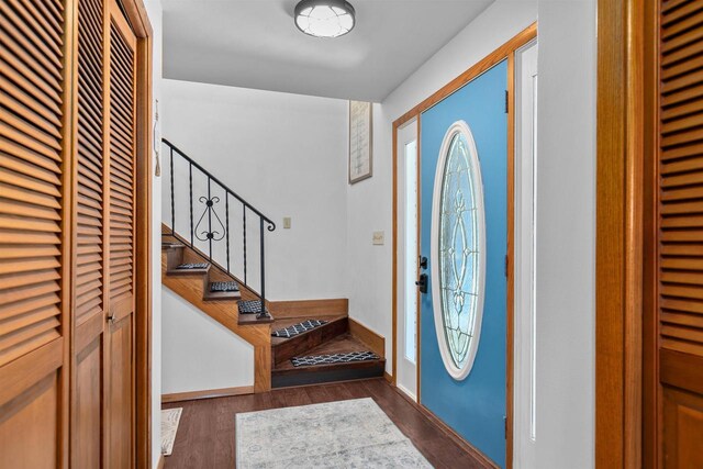1096 Lakeshore Dr, Menasha, WI 54952 - entrance foyer featuring baseboards, wood finished floors, and stairs