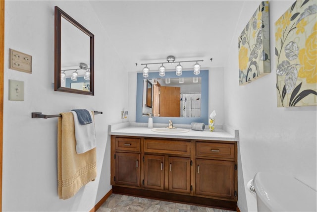 1096 Lakeshore Dr, Menasha, WI 54952 - bathroom featuring baseboards, toilet, and vanity