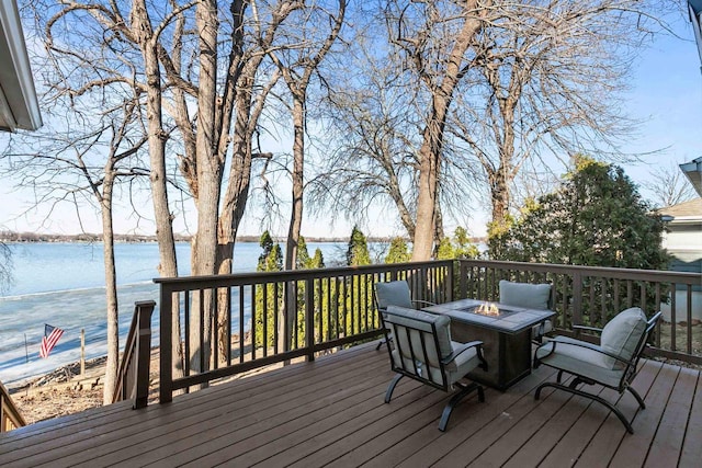 1096 Lakeshore Dr, Menasha, WI 54952 - wooden terrace with an outdoor fire pit and a water view