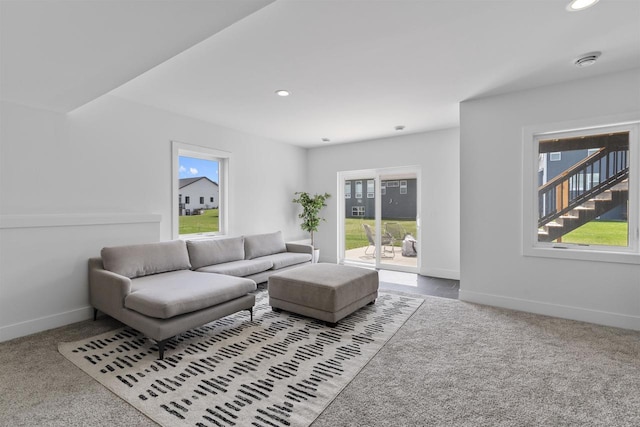carpeted living room featuring recessed lighting and baseboards