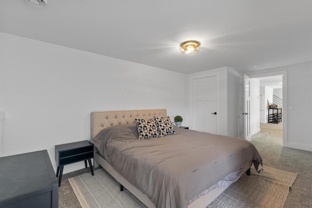 bedroom featuring carpet floors and baseboards