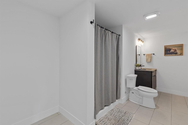 bathroom featuring tile patterned flooring, vanity, toilet, a shower with shower curtain, and baseboards