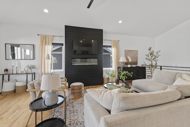 living area featuring recessed lighting and wood finished floors