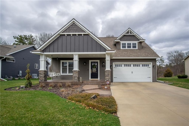 3426 Creek Ridge Dr, Eau Claire, WI 54703 - craftsman house with concrete driveway, a front lawn, board and batten siding, a shingled roof, and a porch