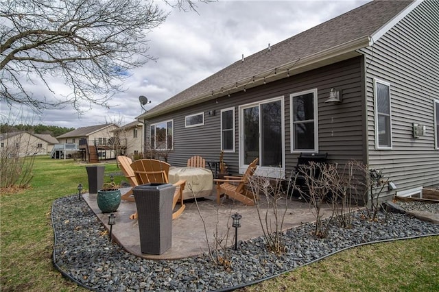 3426 Creek Ridge Dr, Eau Claire, WI 54703 - rear view of house with a shingled roof, heating fuel, a yard, and a patio