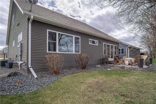 3426 Creek Ridge Dr, Eau Claire, WI 54703 - rear view of house with a patio area, a lawn, entry steps, and central AC