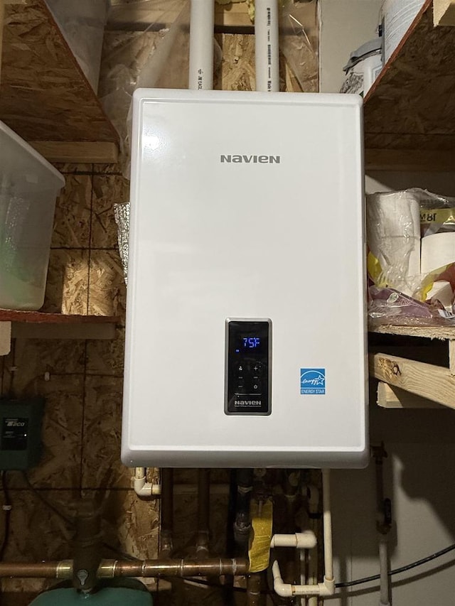 utility room with tankless water heater