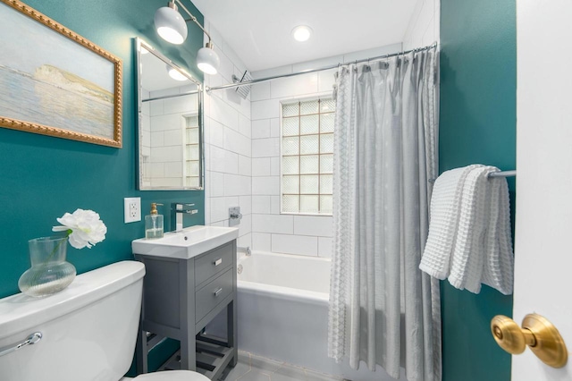 bathroom featuring toilet, vanity, shower / bath combo with shower curtain, and recessed lighting