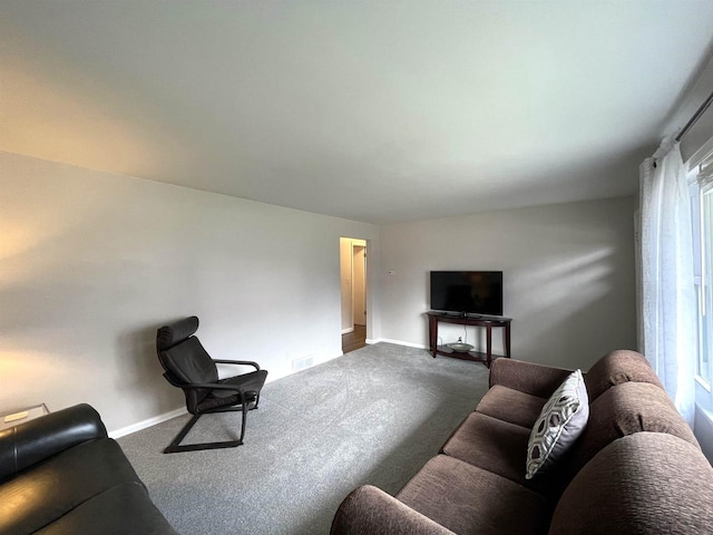 1139 Roscoe St, Green Bay, WI 54304 - living area with dark carpet, visible vents, and baseboards