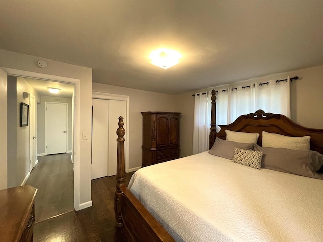 1139 Roscoe St, Green Bay, WI 54304 - bedroom featuring baseboards, a closet, and dark wood-style flooring