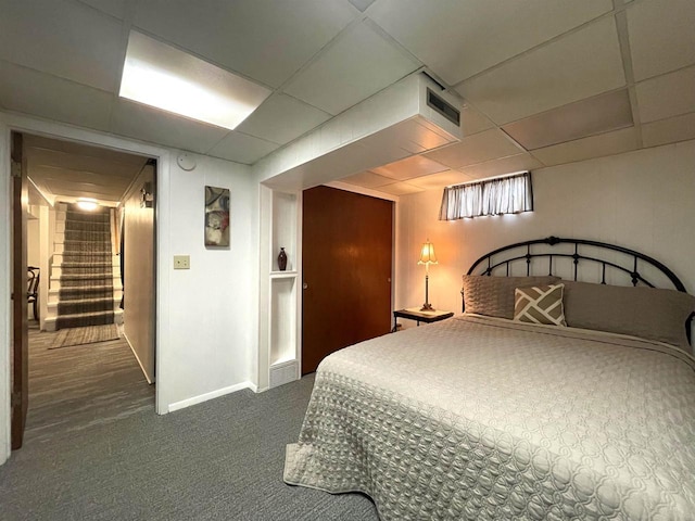 1139 Roscoe St, Green Bay, WI 54304 - bedroom with baseboards, a paneled ceiling, visible vents, and dark carpet
