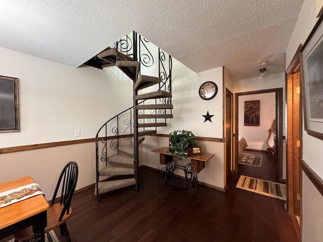 4 Hawthorn Trl, Wisconsin Dells, WI 53965 - staircase with baseboards, a textured ceiling, and wood finished floors