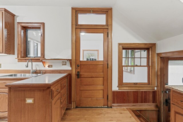 28094 E State Rd, Island Lake, IL 60042 - doorway with vaulted ceiling, light wood-style flooring, and a sink