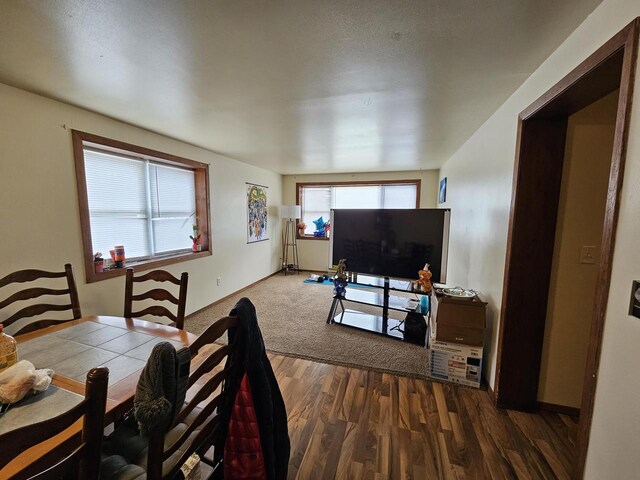 dining room with dark wood finished floors