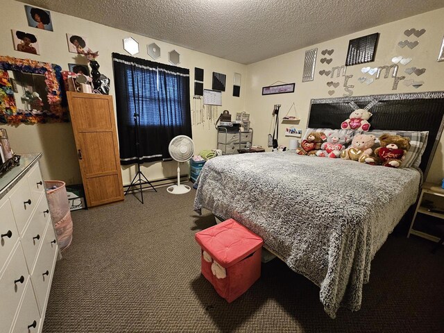 bedroom with carpet floors and a textured ceiling
