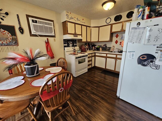 kitchen featuring dark wood-style floors, under cabinet range hood, light countertops, white appliances, and a wall mounted AC