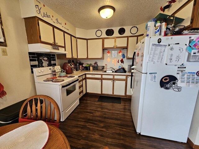 kitchen featuring a textured ceiling, white appliances, light countertops, under cabinet range hood, and dark wood-type flooring