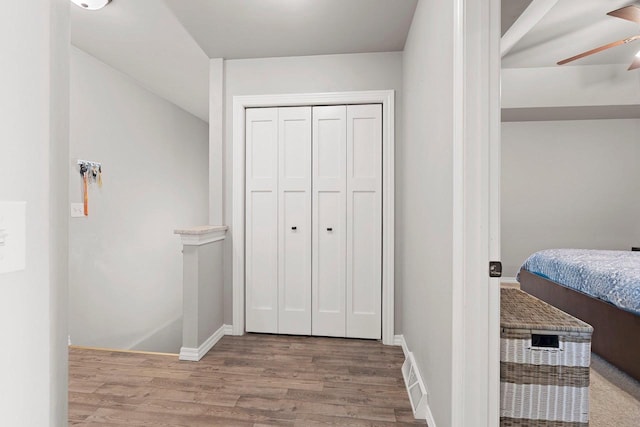 830 Roth Rd, De Pere, WI 54115 - bedroom with wood finished floors, a closet, and baseboards