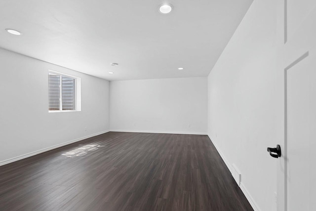 830 Roth Rd, De Pere, WI 54115 - empty room featuring baseboards, dark wood-type flooring, visible vents, and recessed lighting