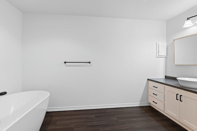 830 Roth Rd, De Pere, WI 54115 - full bath with a soaking tub, baseboards, wood finished floors, and vanity