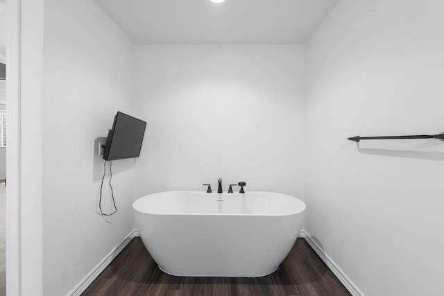 830 Roth Rd, De Pere, WI 54115 - full bathroom with a freestanding bath, baseboards, and wood finished floors
