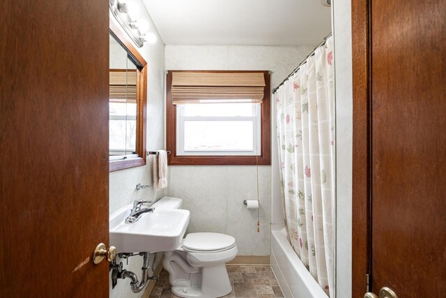 bathroom featuring a sink and toilet