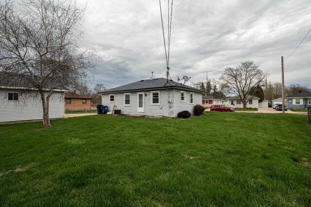 back of house with a yard