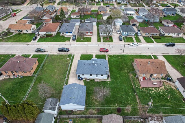 birds eye view of property with a residential view
