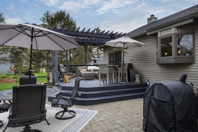 view of patio with a pergola, a wooden deck, grilling area, and outdoor dining space