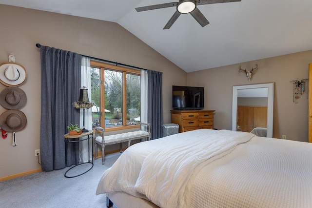carpeted bedroom featuring baseboards, a ceiling fan, and vaulted ceiling