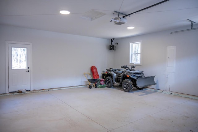 W3090 Yellow Banks Trl, Nekoosa, WI 54457 - garage with recessed lighting and a garage door opener