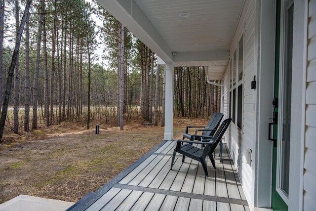 W3090 Yellow Banks Trl, Nekoosa, WI 54457 - deck featuring a wooded view