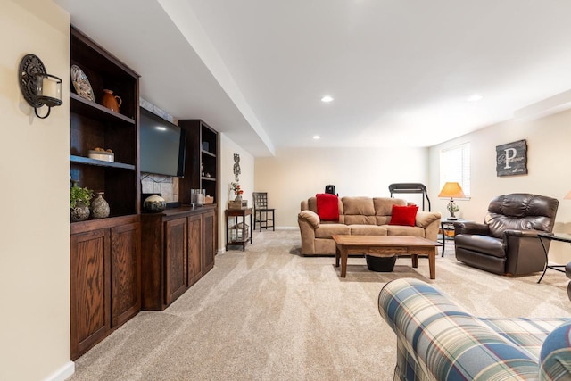 living room with light colored carpet, recessed lighting, and baseboards
