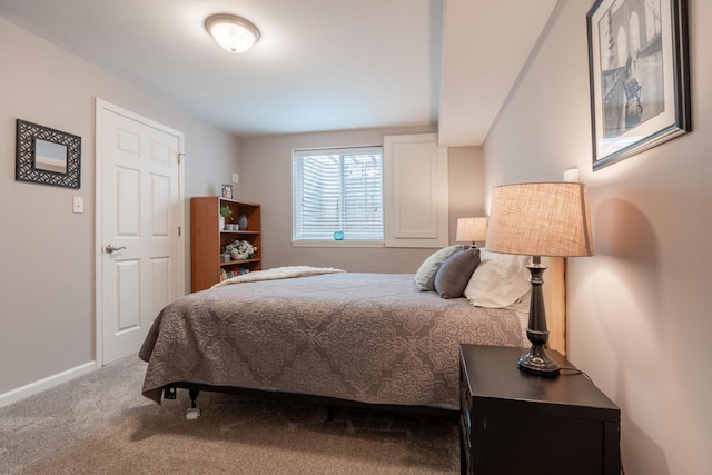 bedroom with carpet floors and baseboards