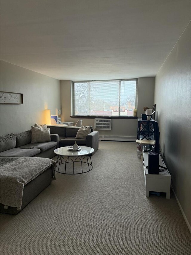 carpeted living room with baseboards, a baseboard radiator, and a wall unit AC