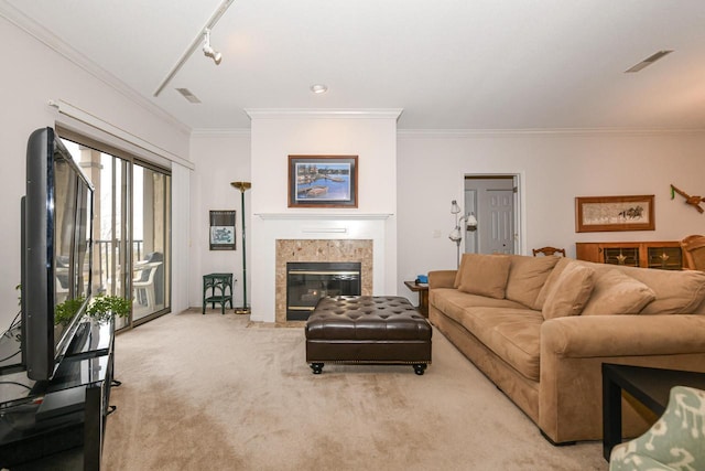 1300 N Prospect Ave Unit 120, Milwaukee, WI 53202 - living area with a tile fireplace, visible vents, light colored carpet, and ornamental molding