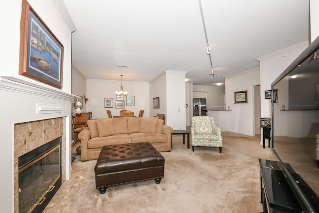 1300 N Prospect Ave Unit 120, Milwaukee, WI 53202 - living area featuring light carpet, a fireplace, a notable chandelier, and ornamental molding