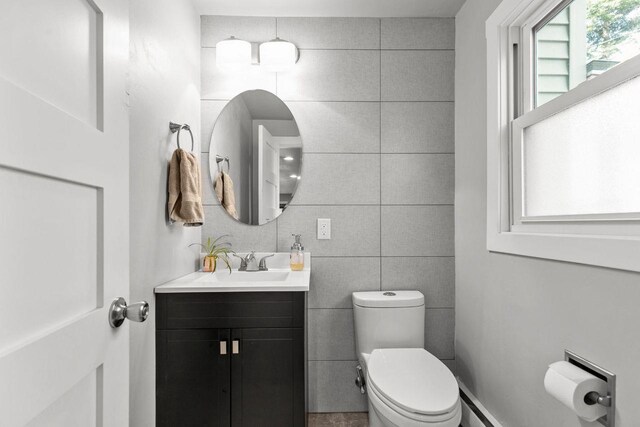 1442 Traeger St, Green Bay, WI 54304 - bathroom featuring tile walls, vanity, and toilet