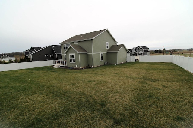 1677 Liatris Dr, Sun Prairie, WI 53590 - back of property with a fenced backyard and a yard