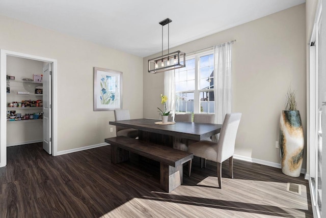 1677 Liatris Dr, Sun Prairie, WI 53590 - dining space with baseboards, wood finished floors, a notable chandelier, and visible vents