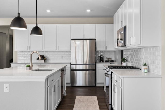 1677 Liatris Dr, Sun Prairie, WI 53590 - kitchen with light countertops, stainless steel appliances, white cabinetry, and a sink